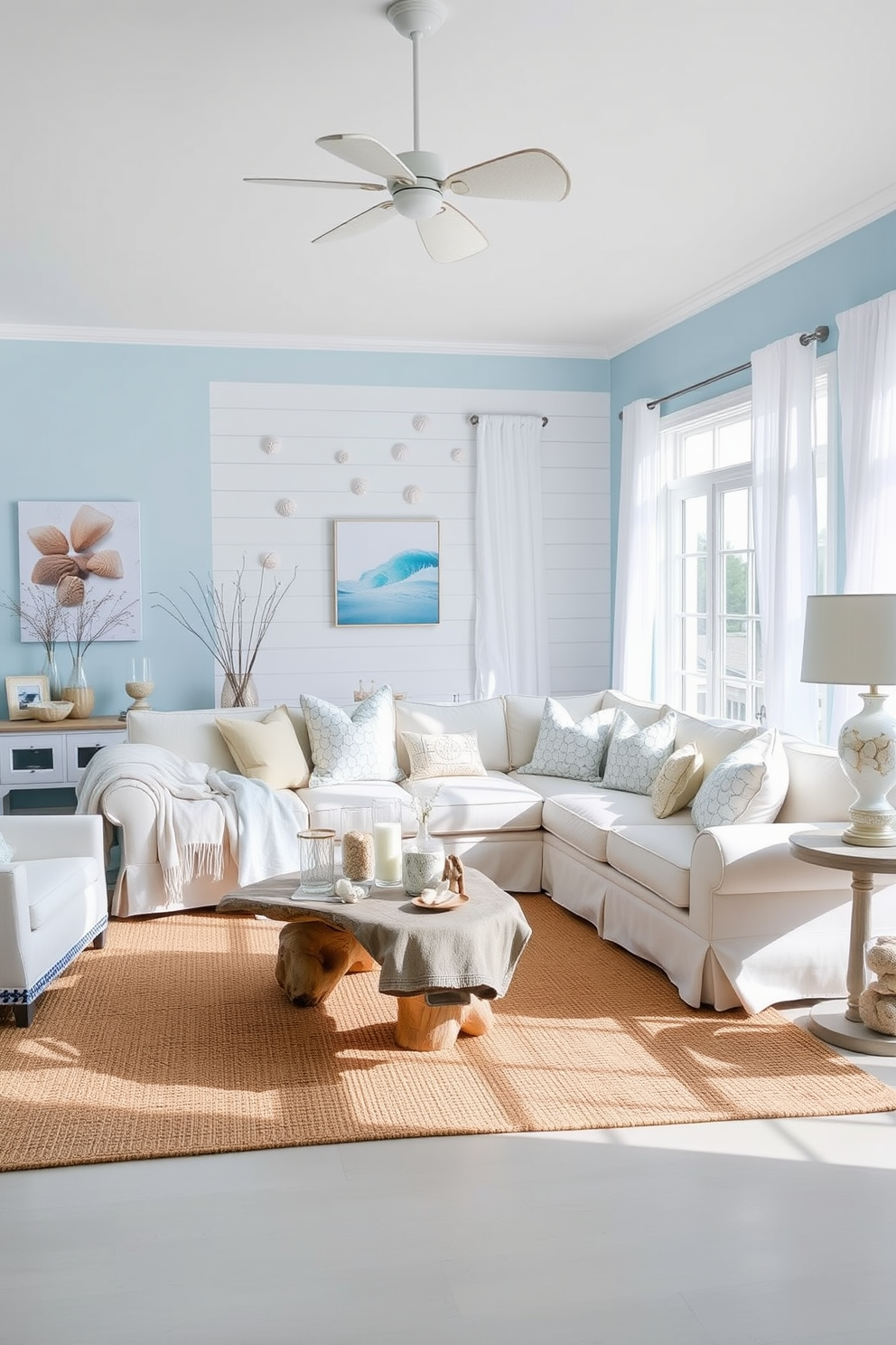 A bright and airy living room that embodies coastal decor. Soft blue walls complement a white shiplap accent wall adorned with seashell art. The space features a large, comfortable sectional sofa draped with light linen throws. A natural jute rug anchors the room, while a driftwood coffee table adds rustic charm. Large windows allow plenty of natural light to flood in, showcasing sheer white curtains that flutter gently in the breeze. Decorative accents include glass vases filled with sand and shells, and a collection of nautical-themed pillows scattered across the sofa.