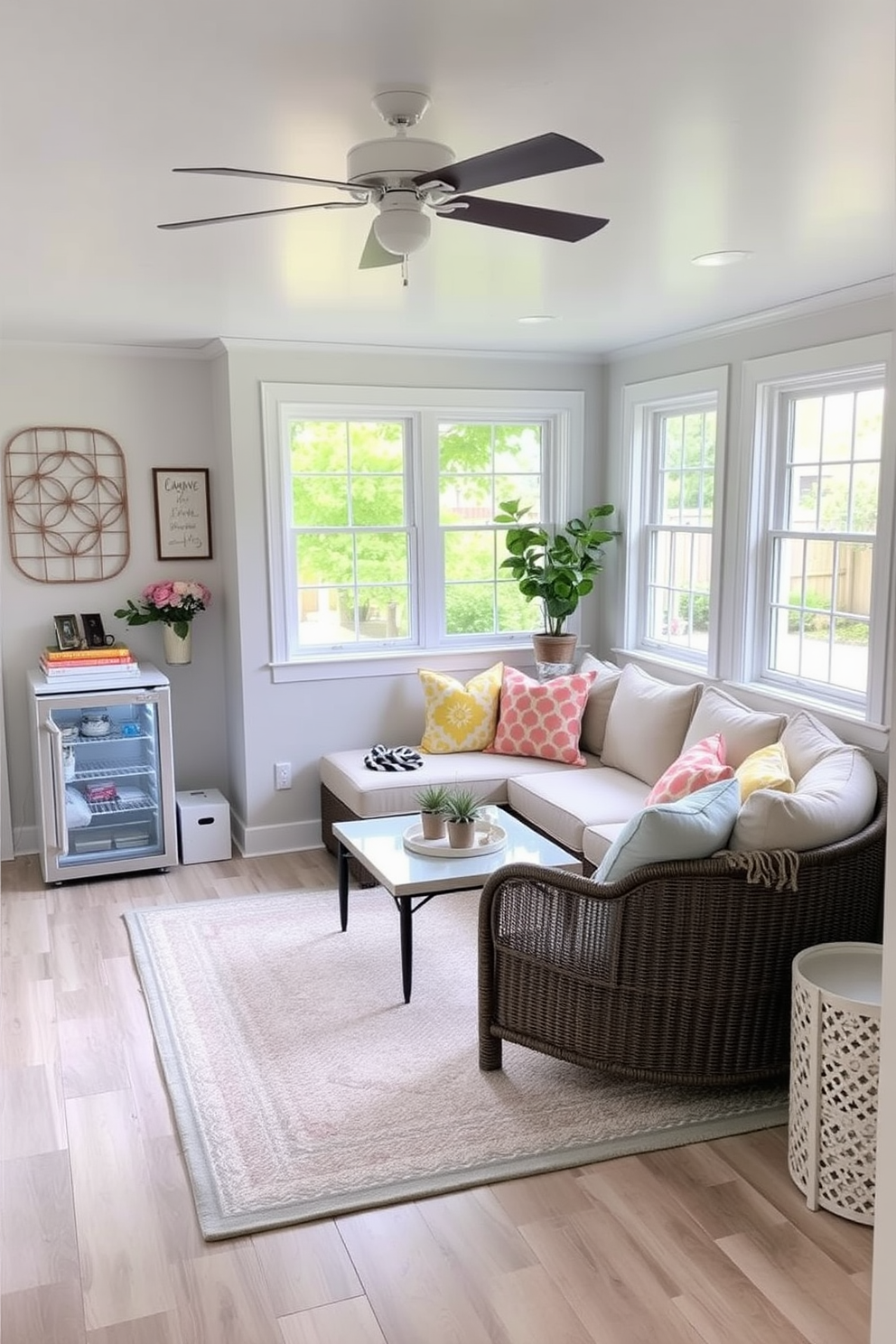 A cozy summer basement retreat with a light and airy atmosphere. The space features a comfortable sectional sofa adorned with bright throw pillows, and a mini fridge is tucked discreetly in the corner for refreshments. Large windows allow natural light to flood the room, enhancing the cheerful ambiance. Soft pastel colors dominate the decor, complemented by a stylish area rug that ties the seating area together.