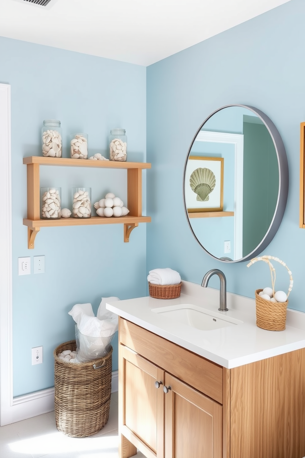 A bright and airy summer bathroom features soft blue walls that evoke the ocean's tranquility. Seashells are artfully arranged in glass jars on the shelves, adding a touch of coastal charm. The vanity is adorned with a natural wood finish and a sleek white countertop, complemented by a large round mirror. A woven basket filled with towels sits nearby, while seashell-themed artwork hangs on the walls to enhance the beach-inspired aesthetic.