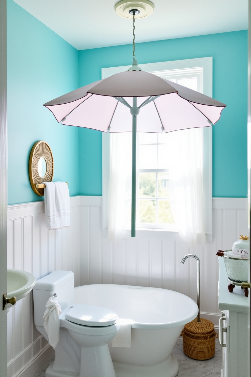 A bright and airy bathroom inspired by summer vibes. The space features a beach umbrella as a playful decor element, creating a relaxed coastal atmosphere. The walls are painted in a soft seafoam blue, complemented by white wainscoting. Natural light floods in through a large window adorned with sheer curtains, enhancing the fresh and inviting feel.