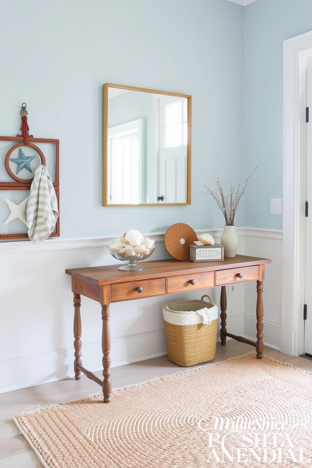 A bright and airy entryway adorned with nautical elements. There are decorative seashells arranged in a glass bowl on a rustic wooden console table. The walls are painted in a soft blue hue reminiscent of the ocean. A woven jute rug lies on the floor, adding texture and warmth to the space.