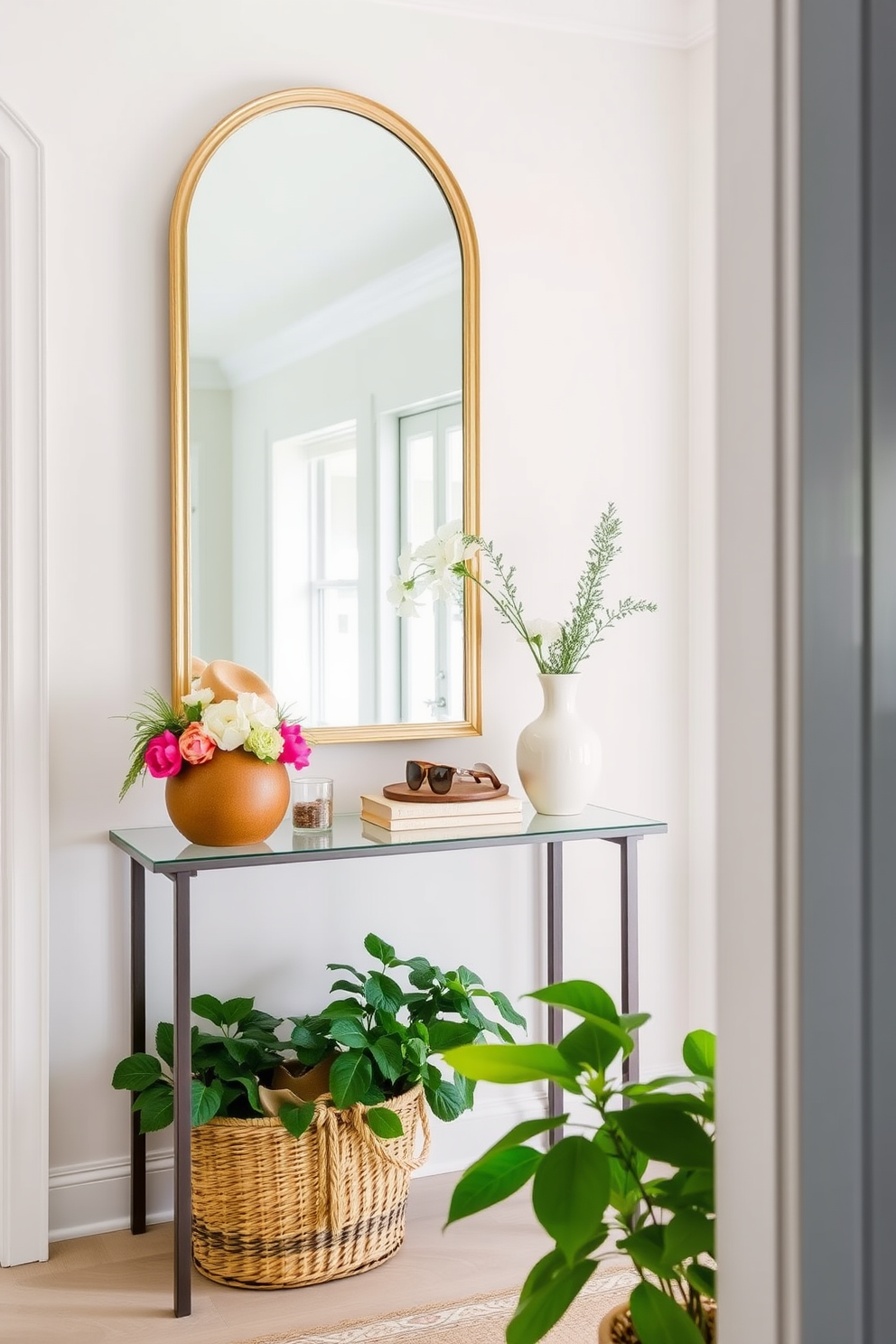 A bright and airy entryway welcomes guests with a statement mirror that reflects natural light. The walls are adorned with light pastel colors, and a stylish console table holds decorative items and fresh flowers. A woven basket sits on the floor to store summer essentials like hats and sunglasses. Lush greenery in the form of potted plants adds a refreshing touch to the space.