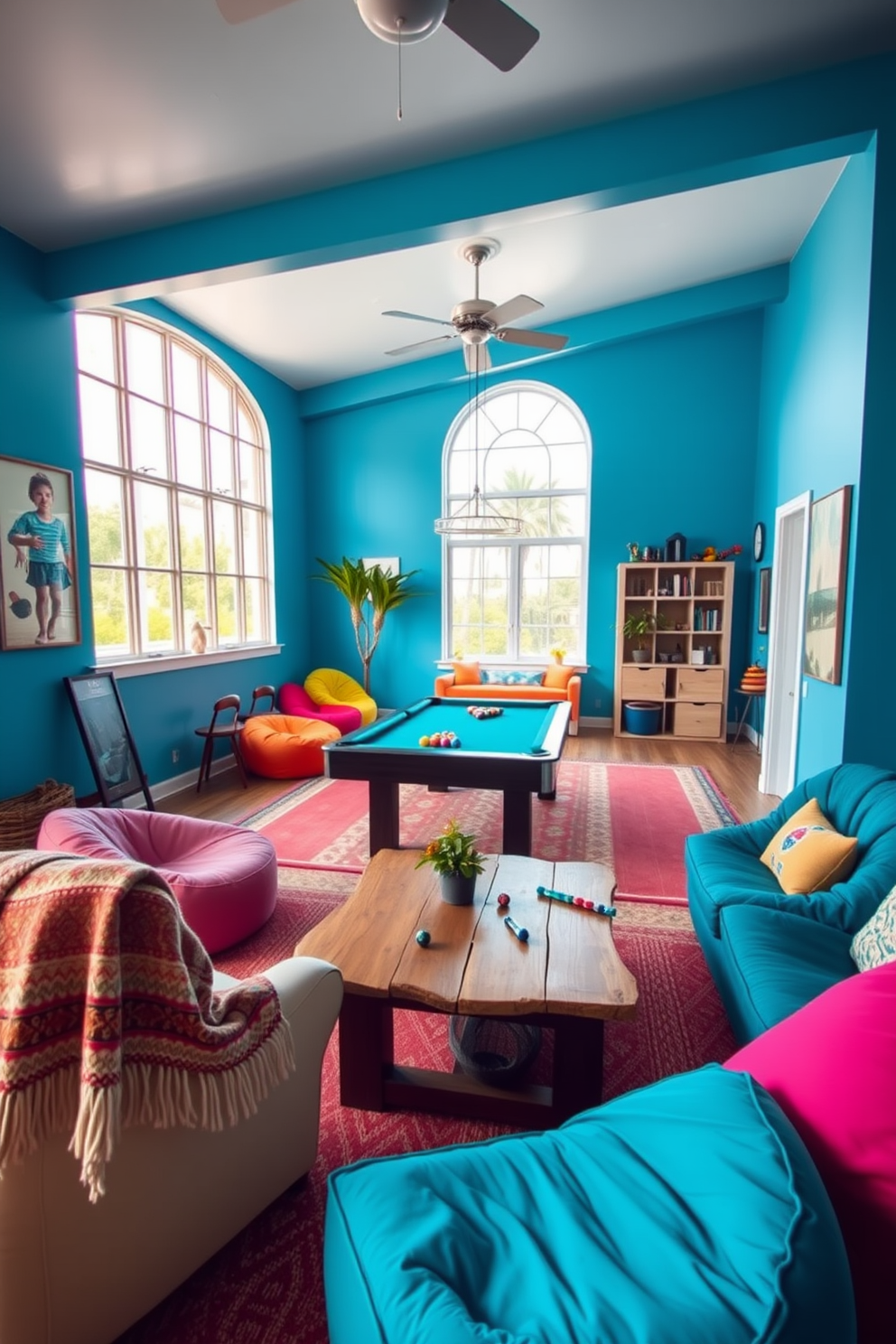 A vibrant game room infused with summer vibes. The walls are painted a bright blue, and a large window lets in natural light, illuminating a spacious area filled with comfortable seating. A sleek pool table occupies the center, surrounded by colorful bean bags and a rustic wooden coffee table. To add warmth, a cozy blanket is draped over one of the chairs, inviting relaxation during chilly nights.