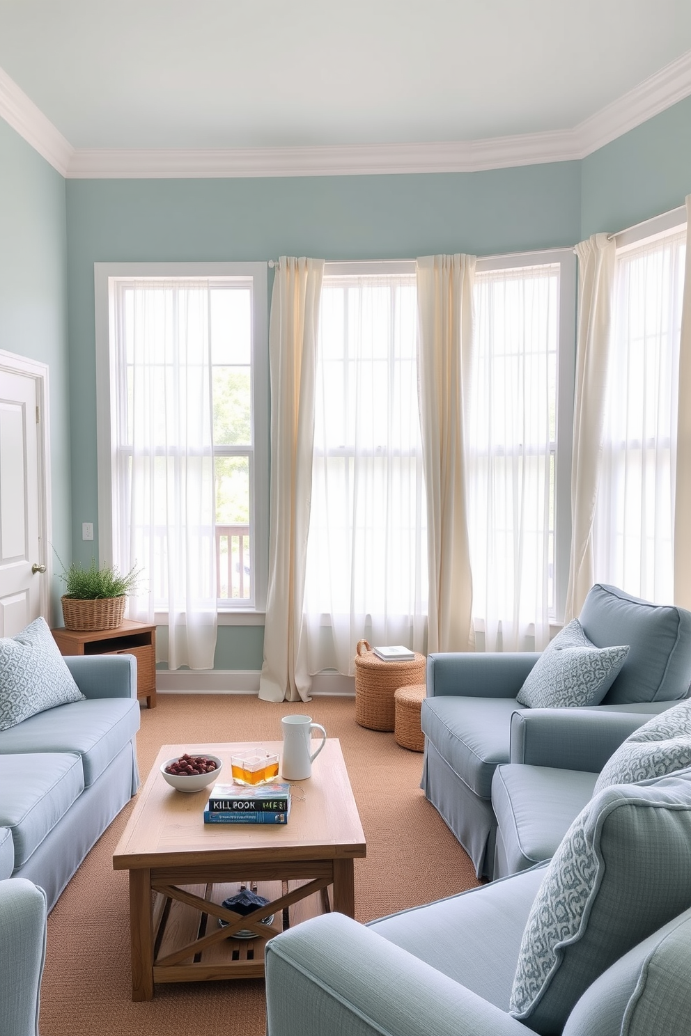 A cozy summer home theater setting featuring a coastal color palette with soft blues and sandy beige accents. The walls are painted in a light seafoam color, and plush seating in soft blue fabric is arranged for optimal viewing comfort. Large windows allow natural light to filter in, adorned with sheer white curtains that flutter gently in the breeze. A wooden coffee table in a driftwood finish holds snacks and drinks, completing the inviting atmosphere.