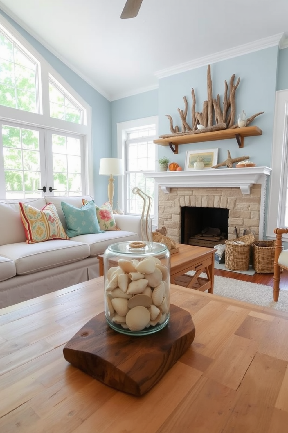 A bright and airy summer living room adorned with seashells and driftwood as natural decor. The space features a comfortable white sofa with colorful throw pillows, complemented by a rustic coffee table made from reclaimed wood. Large windows allow sunlight to flood the room, highlighting the soft blue accent walls. A collection of seashells is displayed in a glass jar on the table, while driftwood accents are artfully arranged on the mantelpiece.