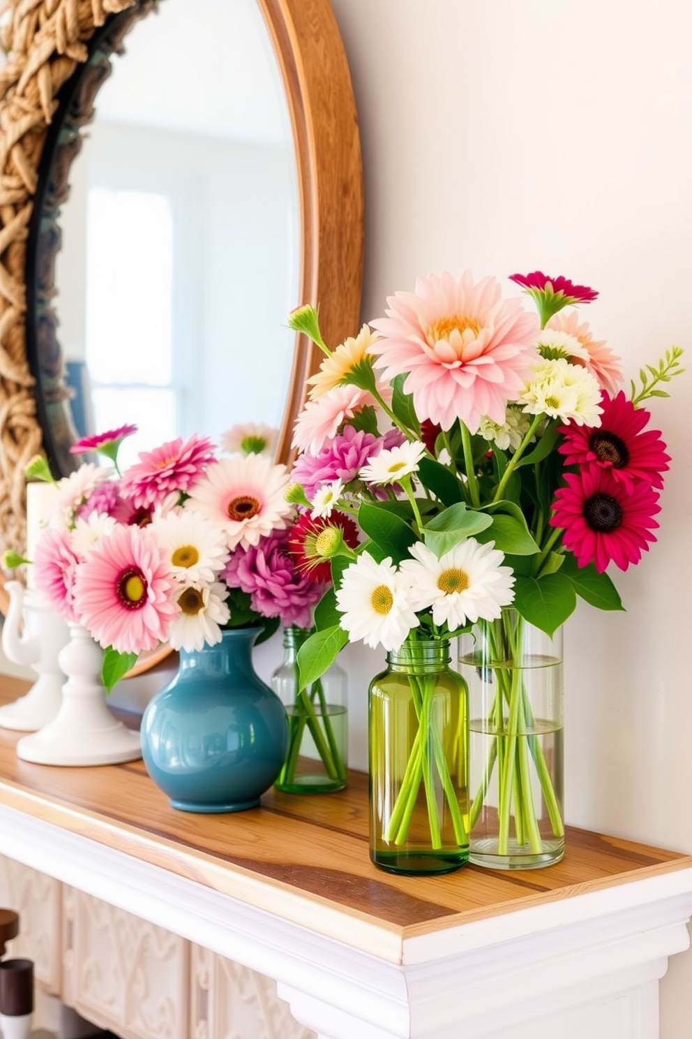 Fresh flowers in vibrant vases adorn a beautifully styled summer mantel. The mantel features a mix of natural wood and white accents, creating a warm and inviting atmosphere.