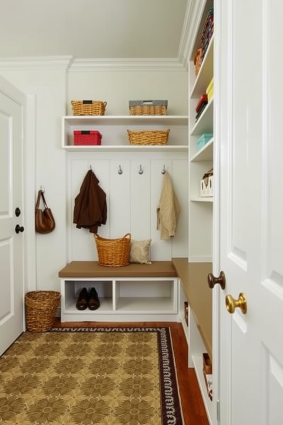 A bright and airy mudroom features open shelving along one wall, showcasing colorful baskets and decorative items. The floor is covered with a durable, patterned rug, and a bench with cushions provides a cozy spot to sit and remove shoes.