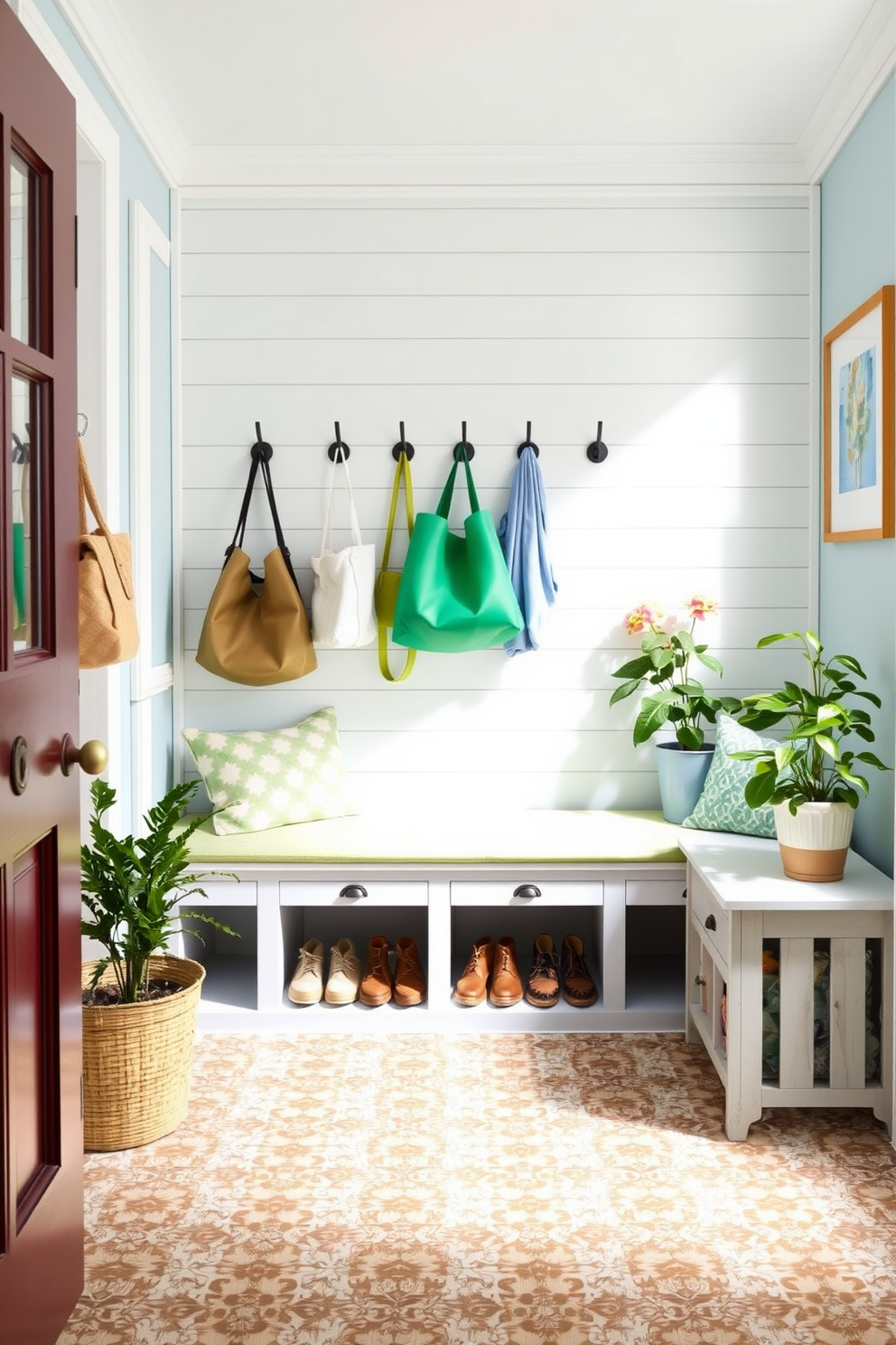 A welcoming summer mudroom features a light and airy color palette with soft blue walls and white trim. Hooks are installed at varying heights on a shiplap wall, providing easy access for bags and outdoor gear. The floor is adorned with a durable, patterned tile that can withstand muddy shoes, while a cozy bench with storage underneath invites guests to sit and remove their footwear. Potted plants and bright artwork add a cheerful touch, enhancing the inviting atmosphere of the space.