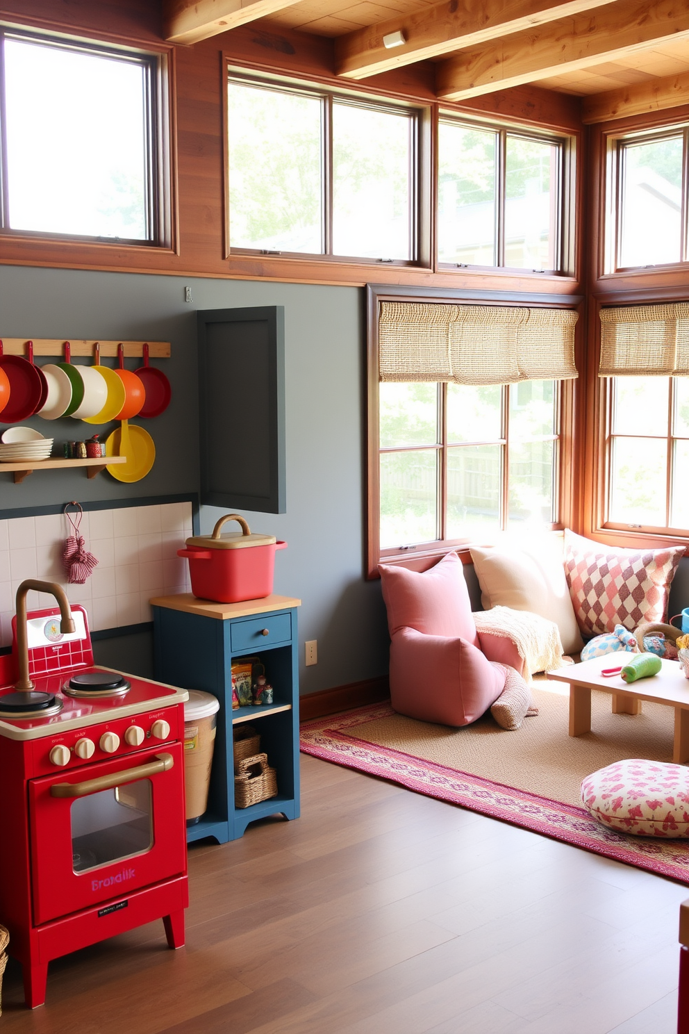 A whimsical pretend play kitchen area designed for children. The kitchen features a bright red play stove with knobs, a wooden sink with a faux faucet, and colorful pots and pans hanging on the wall. Adjacent to the kitchen, a cozy summer playroom invites creativity. The space is filled with soft, oversized cushions, a small table for crafts, and large windows that let in plenty of natural light.