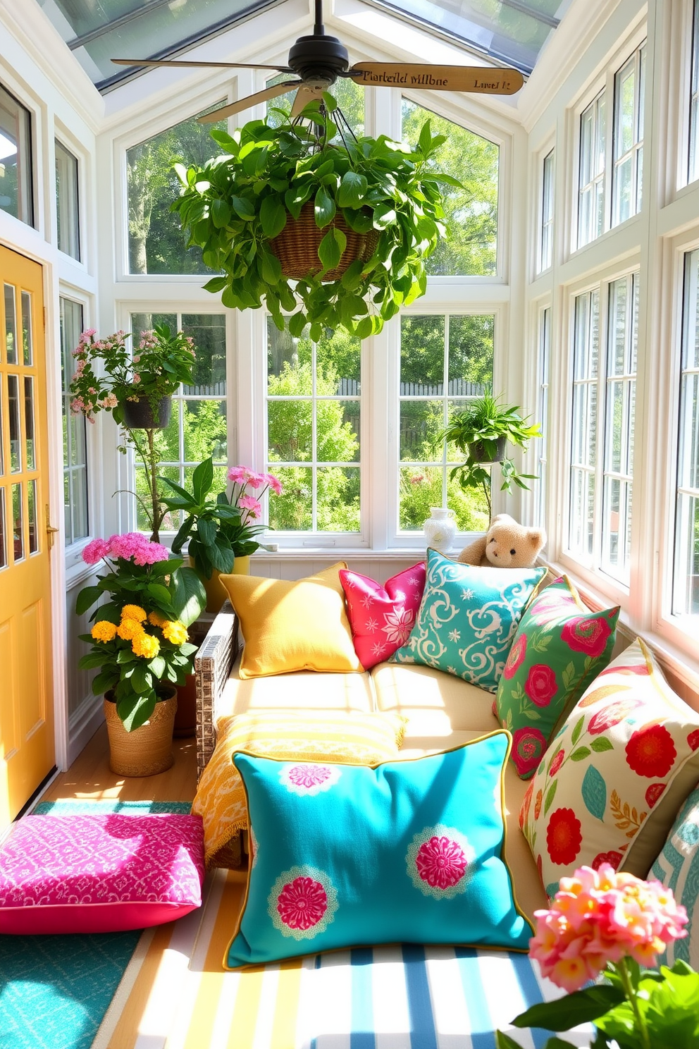 A bright and inviting sunroom filled with natural light. The space features a comfortable seating area adorned with colorful throw pillows in various patterns and textures. Large windows allow the summer sun to stream in, illuminating the room's vibrant decor. Potted plants and flowers add a touch of greenery, enhancing the cheerful atmosphere.