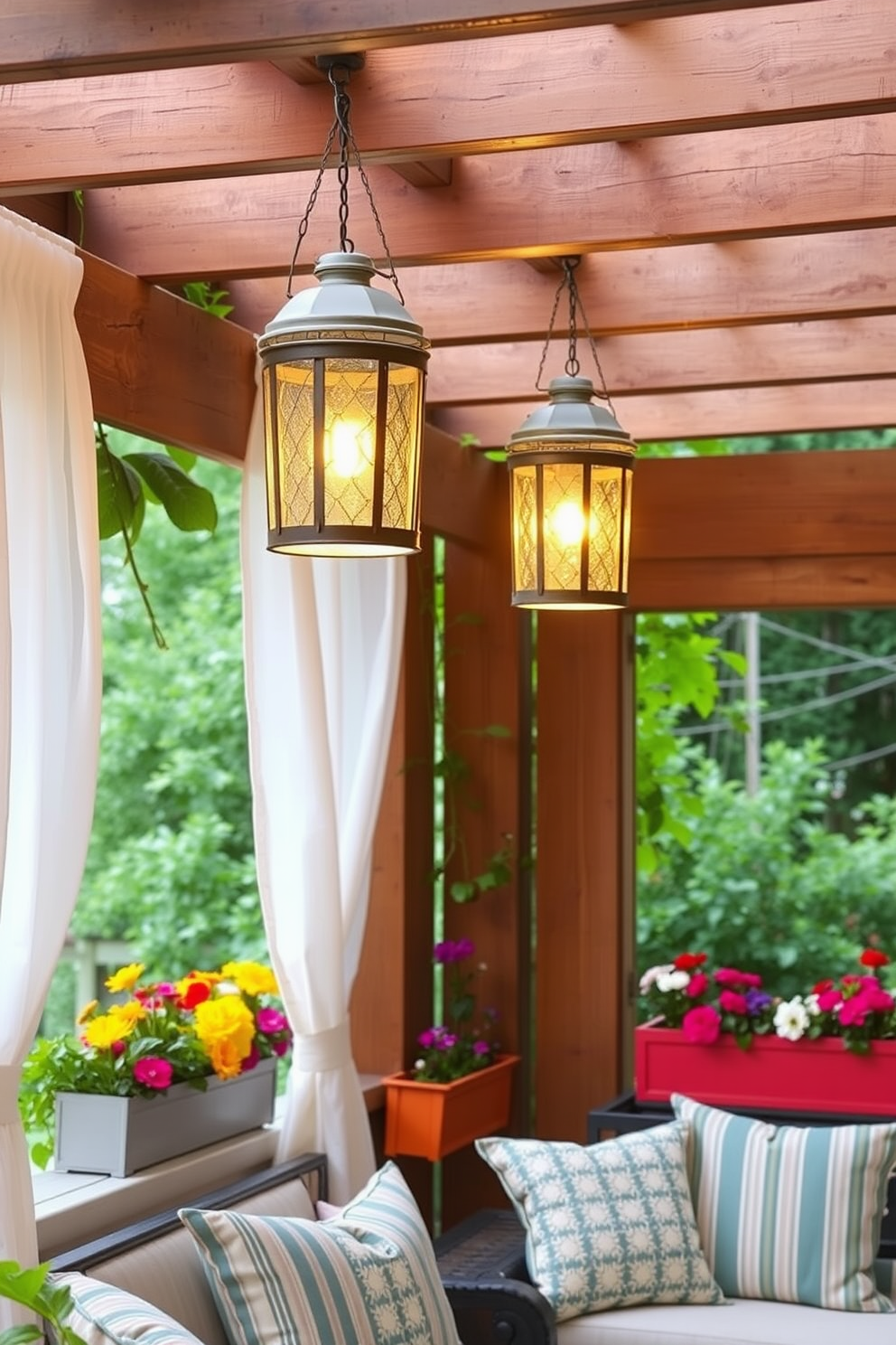 Hanging lanterns cast a warm glow over a cozy outdoor seating area. They are suspended from a wooden pergola, surrounded by lush greenery and soft cushions. Summer window decorating ideas feature light, airy curtains that flutter gently in the breeze. Brightly colored flower boxes filled with blooming plants add a cheerful touch to the window sills.